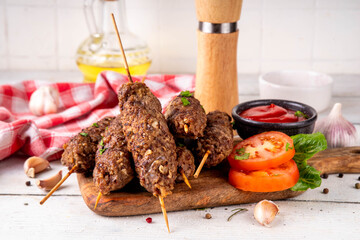 Shish kebab on stick, made from ground beef meat. Lula kebab, traditional Caucasian dish, with...
