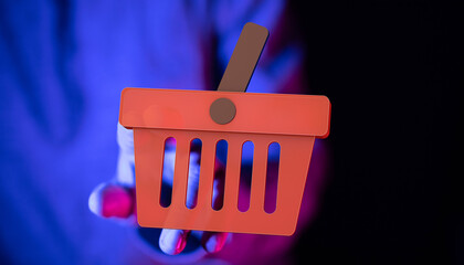 3D rendering of a red shopping cart icon held in a hand, perfect for e-commerce and online retail...