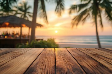 Wooden table surface with a blurred background of a tropical beach bar at sunset.