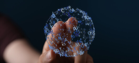 Abstract image of a hand interacting with a sphere of letters, representing knowledge and data.