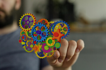 Abstract image of colorful gears representing teamwork, innovation, and technology.
