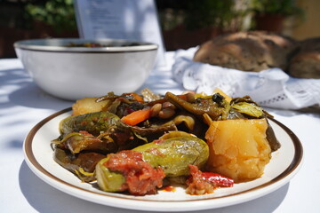 “Sympetherió tou Kípou,” a traditional Cretan dish cooked with any garden vegetables found at summer’s end—eggplants, zucchini, greens, peppers, potatoes. Served outdoors with handmade eftazymo bread.