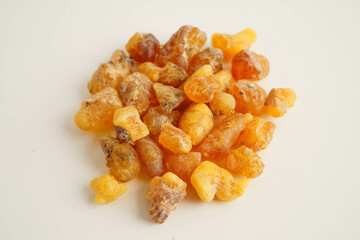 Frankincense or olibanum aromatic resin isolated on white background used in incense and perfumes.