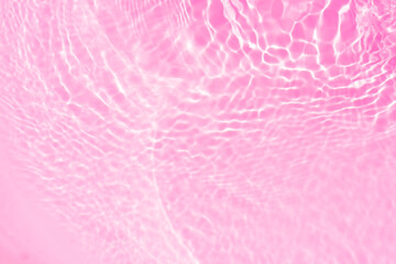 Pink water bubbles on the surface ripples. Defocus blurred transparent pink colored clear calm...
