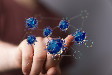 Image of a hand interacting with a 3D model of a coronavirus network. Ideal for medical research, science, and technolog