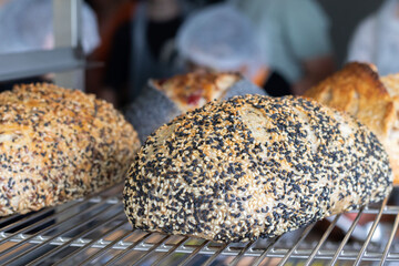 Appetizing freshly baked craft loaves of bread close-up in a bakery