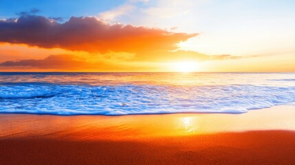 Obraz premium Vibrant sunset over waves on a tranquil beach with golden sands and clouds