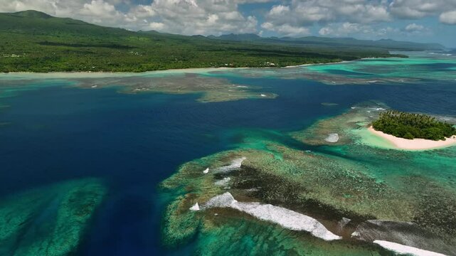 Aerial view of tropical island and reef with ocean, Samoa.