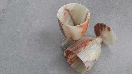 A composition consisting of stone glasses, carved from translucent onyx stone. They have smooth natural patterns in warm beige-brown tones, which gives them a noble and natural look.