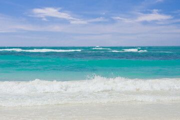Explore a Serene and Beautiful Tropical Beach Featuring Gentle Waves and Pristine Clear Blue Water