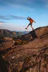 Man athlete trail running in mountains travel extreme adventure outdoor, healthy lifestyle active...