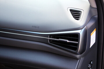 Lux electric car air vents close-up grille. Air ventilation grille with power regulator. Lux...