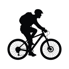 Obraz premium Silhouette of a person wearing a helmet and backpack riding a mountain bike