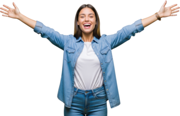 Young woman with arms outstretched smiling broadly wearing a denim shirt and jeans