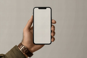 hand holding mobile phone with blank display