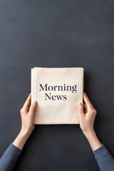 Folded paper with Morning News headline held by hands, elegant clean layout for print or design