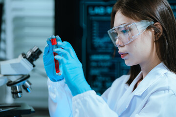 A scientist in a modern laboratory analyzes a blood sample using advanced biotechnology and equipment, conducting medical research for diagnostics, innovation, discovery, and healthcare development.