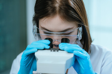 A scientist in a modern laboratory analyzes a blood sample using advanced biotechnology and equipment, conducting medical research for diagnostics, innovation, discovery, and healthcare development.