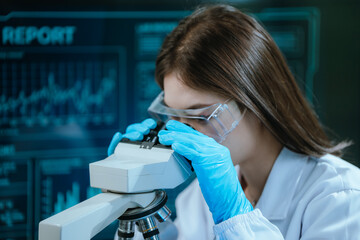 A scientist in a modern laboratory analyzes a blood sample using advanced biotechnology and...