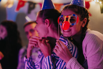 A spirited family celebration with festive decorations, joyful expressions, and party accessories.