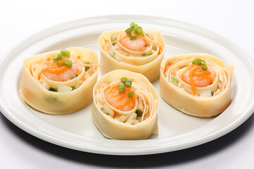 tortilla wraps with shrimp and avocado arranged in round shape on white plate