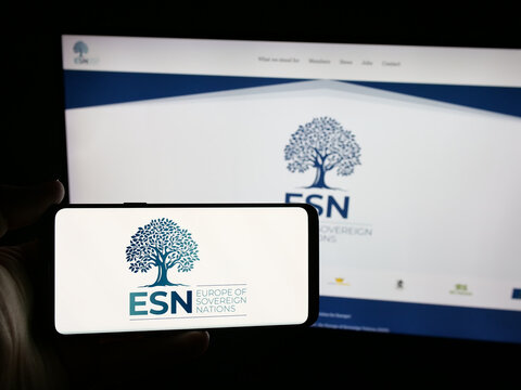 Stuttgart, Germany - 07-07-2025: Person holding smartphone with logo of European People's Party Group (EPP Group) on screen in front of website. Focus on phone display.