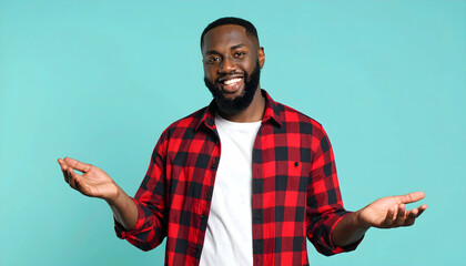 Cheerful Black Man in Red Plaid Shirt Smiling Against Light Blue Background