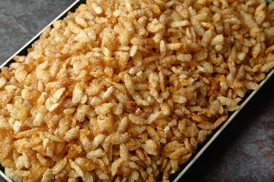 Healthy savoury snack food - flatten rice mixture.