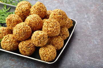Homemade delicious Indian sweet snack food- sesame balls, ellunda, til ke gole,