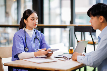 Female nurse hold her man patient's hand. Concept of giving Support. 
