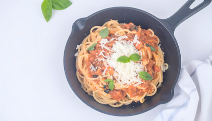 Overhead Studio Shot Delicious Spaghetti Pasta with Tomato Sauce and Basil