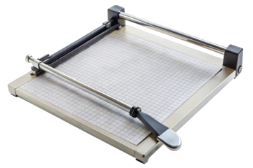 Modern paper guillotine trimmer with grid markings on the base and a silver cutting arm isolated on transparent background