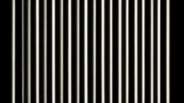 Abstract vertical lines pattern, white stripes on black background.
