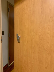 Ajar door to hospital room. Slightly open door.