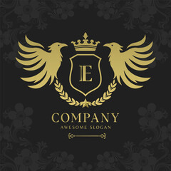 Bird heraldry modern style with a shield and crown logo template Premium Vector