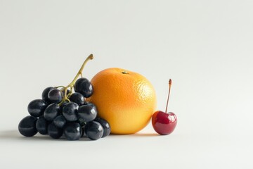 Pile of assorted fresh fruits on white background. Apples, grapes, oranges, lemons, and pomegranates. Vibrant colors. Clean studio light. Healthy eating, nutrition, and harvest concept. Copy space
