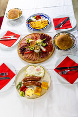 Traditional Serbian Breakfast Table with Meza, Eggs, and Sides