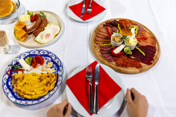 Traditional Serbian Breakfast Table with Meza, Eggs, and Sides