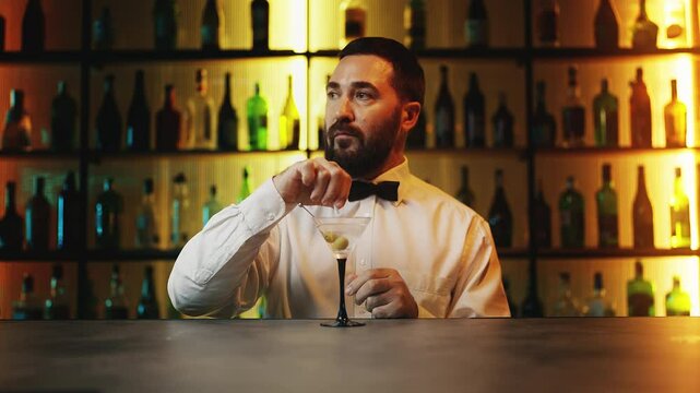 Sneaky barman adding drugs into a cocktail, spiking drink, criminal behavior