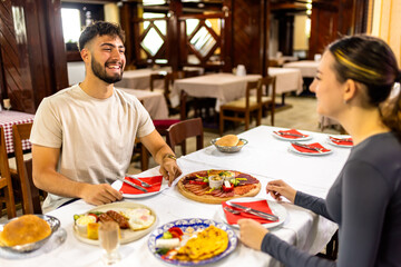 Couple at Resort Restaurant Enjoying Traditional Breakfast