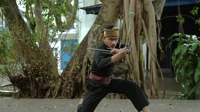 Young Martial Artist with Bow and Arrow in Nature
