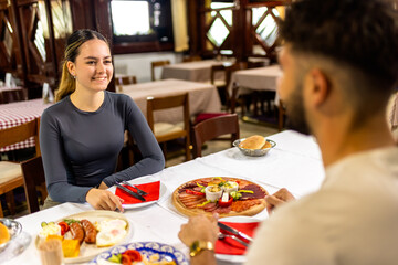 Couple at Resort Restaurant Enjoying Traditional Breakfast