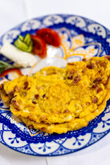  Scrambled Eggs with Bacon and Fresh Vegetables on Plate