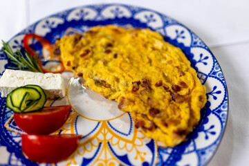  Scrambled Eggs with Bacon and Fresh Vegetables on Plate