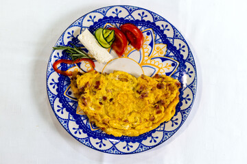  Scrambled Eggs with Bacon and Fresh Vegetables on Plate