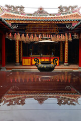 The interior of the temple reflected in the flat surface
