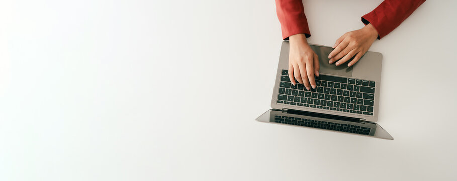 Close-up portrait typing keyboard on laptop computer. Working online on white table at office. Facebook chat. Website meeting. Blogger. Journalist writing articles. online job ideas