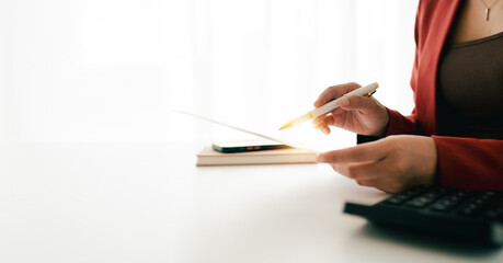 Accountant working on desk using calculator to calculate financial report in office business accounting finance concept