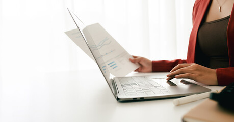 Portrait of a woman doing income and expenditure, accounting, finance, tax filing documents.