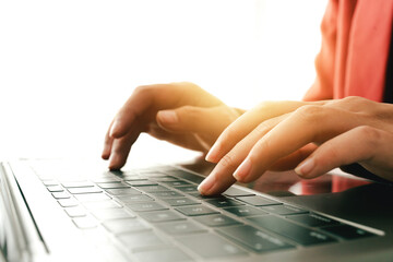 Close-up portrait typing keyboard on laptop computer. Working online on white table at office. Facebook chat. Website meeting. Blogger. Journalist writing articles. online job ideas